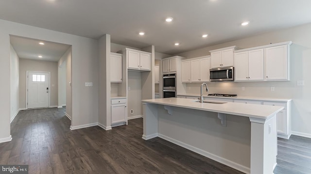 139 Erica Ln, Columbia, PA 17512 - kitchen with stainless steel appliances, a sink, white cabinetry, dark wood-style floors, and light countertops