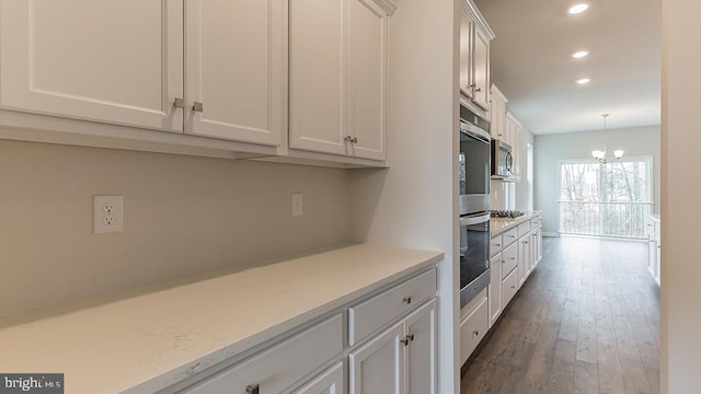 139 Erica Ln, Columbia, PA 17512 - kitchen featuring recessed lighting, stainless steel appliances, light countertops, white cabinets, and dark wood finished floors