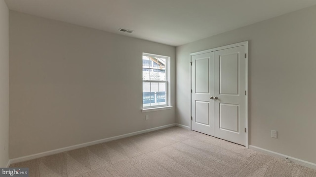 139 Erica Ln, Columbia, PA 17512 - unfurnished bedroom with light colored carpet, baseboards, and a closet