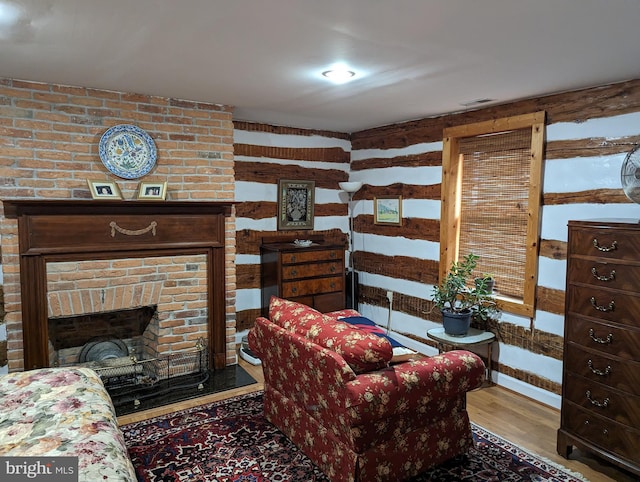 2834 E Boss Arnold Rd, Jefferson, MD 21755 - living room featuring wood finished floors and a fireplace