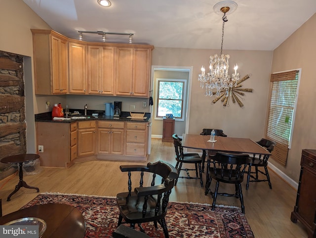 2834 E Boss Arnold Rd, Jefferson, MD 21755 - kitchen featuring dark countertops, light wood finished floors, a chandelier, baseboards, and light brown cabinetry