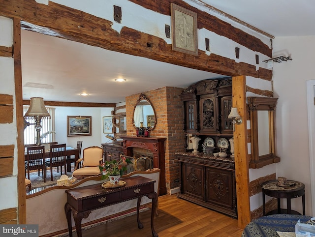2834 E Boss Arnold Rd, Jefferson, MD 21755 - living room featuring light wood-type flooring and a brick fireplace