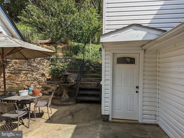 2834 E Boss Arnold Rd, Jefferson, MD 21755 - view of exterior entry with a patio and outdoor dining space