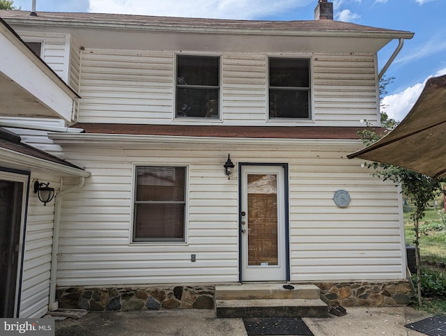 2834 E Boss Arnold Rd, Jefferson, MD 21755 - view of exterior entry featuring a chimney