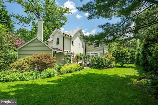 315 Linden Ave, Doylestown, PA 18901 - back of property featuring a chimney, a yard, and stucco siding