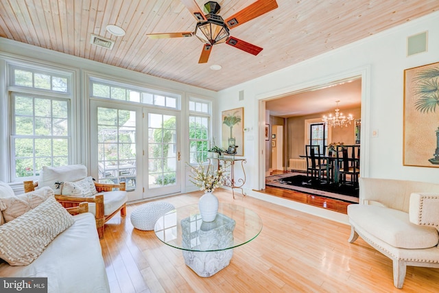315 Linden Ave, Doylestown, PA 18901 - living room featuring radiator, a chandelier, wood ceiling, wood finished floors, and a ceiling fan