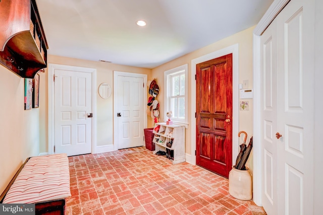 315 Linden Ave, Doylestown, PA 18901 - entryway with baseboards, brick floors, and recessed lighting