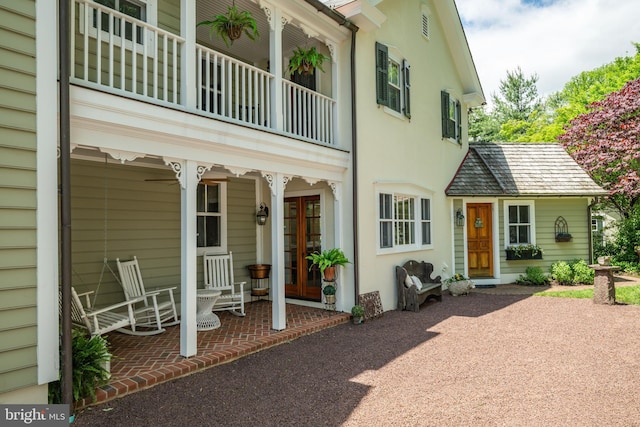 315 Linden Ave, Doylestown, PA 18901 - back of property with french doors, a balcony, covered porch, and stucco siding