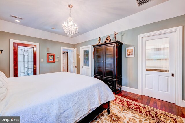 315 Linden Ave, Doylestown, PA 18901 - bedroom with wood finished floors, a chandelier, and baseboards