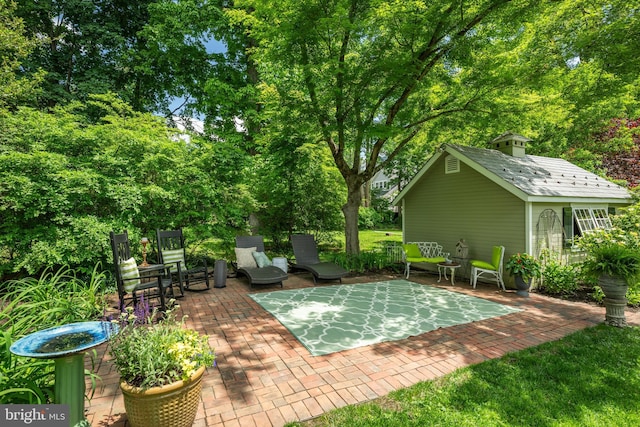 315 Linden Ave, Doylestown, PA 18901 - view of patio with an outdoor structure and view of wooded area