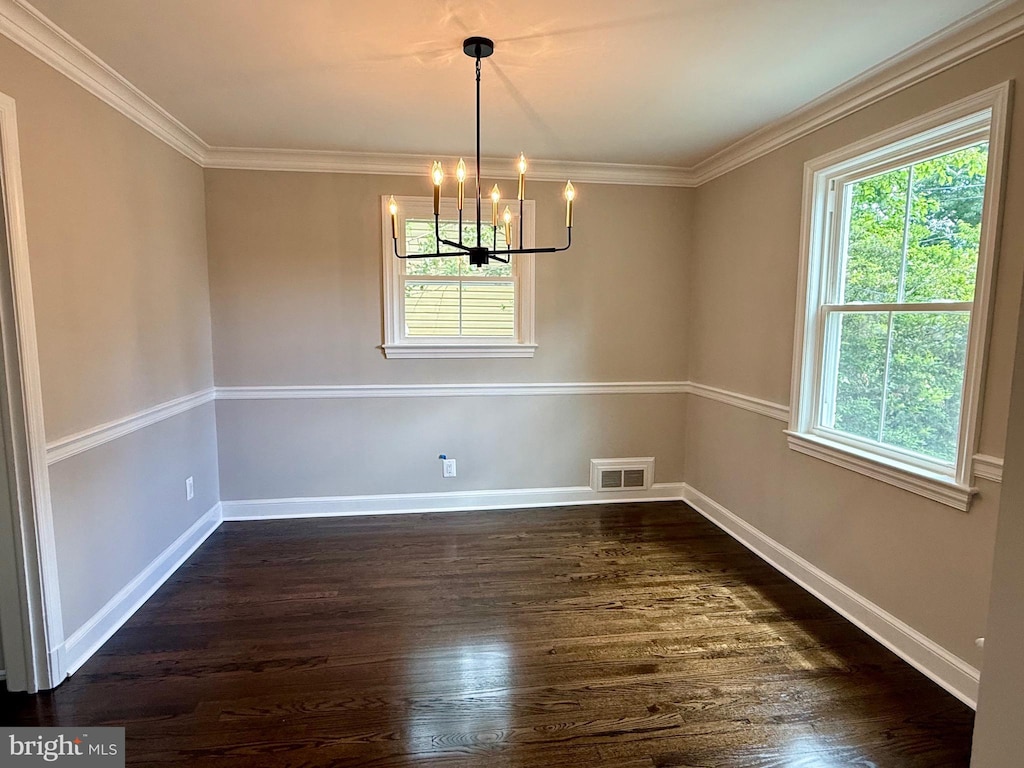 5141 10th St N, Arlington, VA 22205 - spare room with a chandelier, dark wood-style floors, crown molding, and baseboards