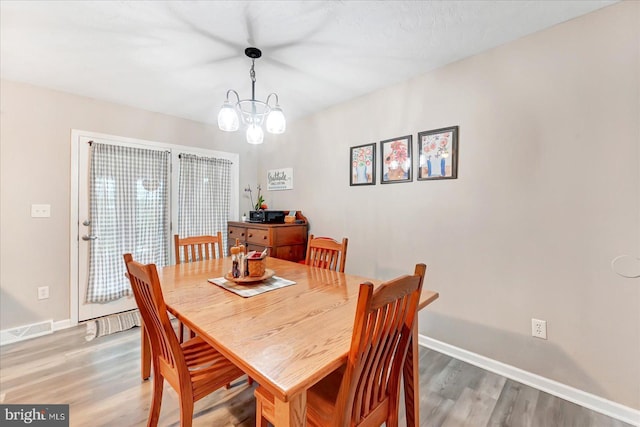 96 Billerbeck St, New Oxford, PA 17350 - dining area featuring light wood-style floors, baseboards, and a chandelier