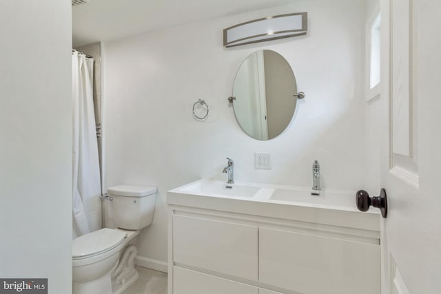 229 Shoemaker Rd, Bridgeton, NJ 08302 - bathroom with toilet, vanity, and baseboards