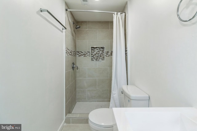 229 Shoemaker Rd, Bridgeton, NJ 08302 - full bathroom featuring toilet, tiled shower, and tile patterned flooring