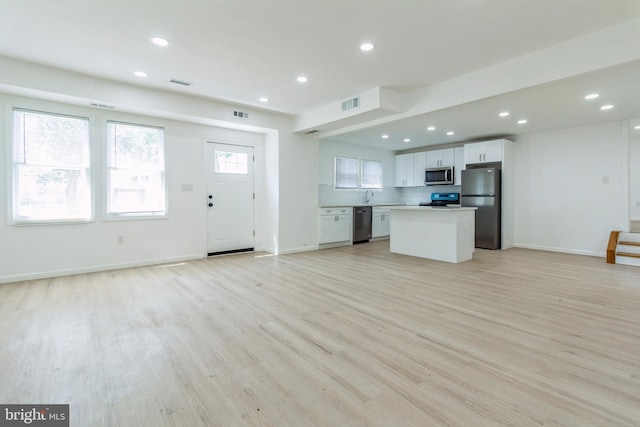 229 Shoemaker Rd, Bridgeton, NJ 08302 - unfurnished living room with light wood-style flooring, recessed lighting, and baseboards