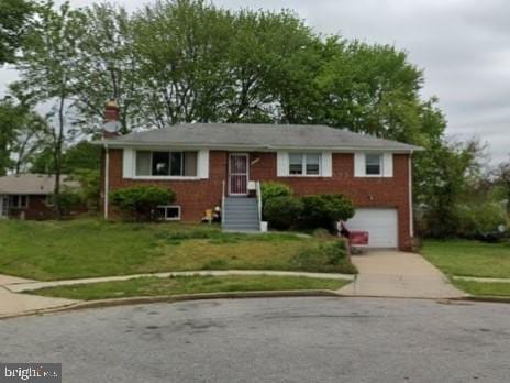 2116 Gaither St, Temple Hills, MD 20748 - view of front facade with driveway, a front yard, brick siding, and an attached garage
