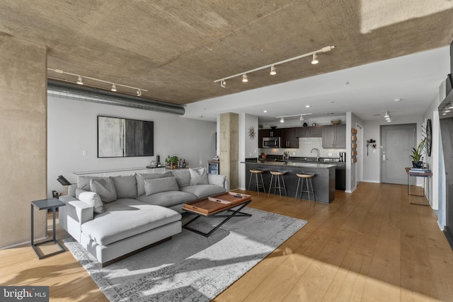 1200 Steuart St Unit 326, Baltimore, MD 21230 - living area featuring track lighting and light wood-style floors