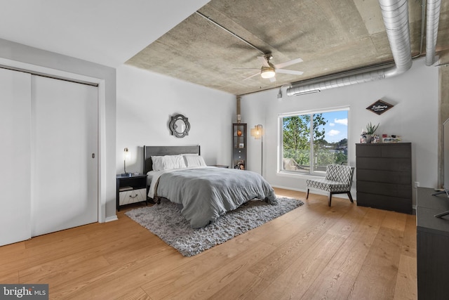 1200 Steuart St Unit 326, Baltimore, MD 21230 - bedroom featuring light wood-style floors, a ceiling fan, and a closet
