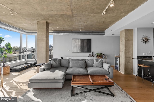 1200 Steuart St Unit 326, Baltimore, MD 21230 - living room with track lighting, wood finished floors, and beverage cooler