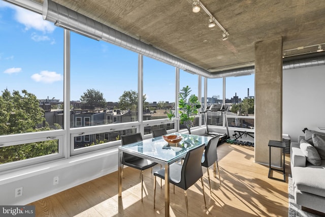 1200 Steuart St Unit 326, Baltimore, MD 21230 - sunroom featuring track lighting, plenty of natural light, and wood finished floors