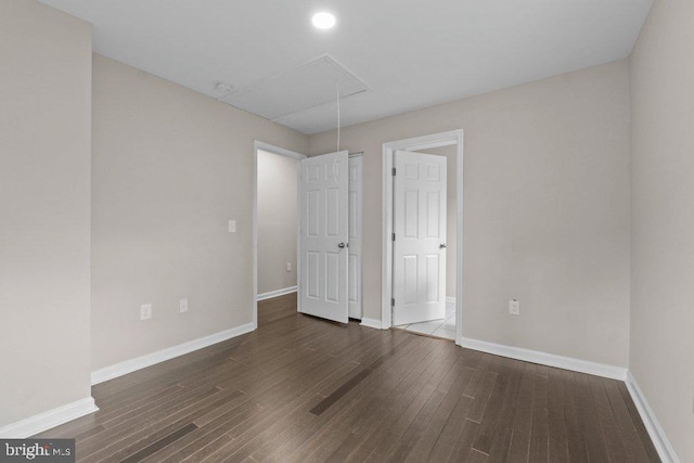 101 Poppleton St, Baltimore, MD 21201 - unfurnished bedroom with attic access, baseboards, wood finished floors, and recessed lighting