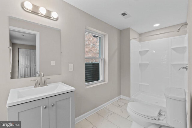 101 Poppleton St, Baltimore, MD 21201 - bathroom with marble finish flooring, toilet, baseboards, vanity, and a shower