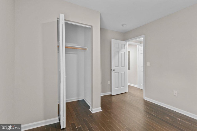 101 Poppleton St, Baltimore, MD 21201 - unfurnished bedroom featuring wood finished floors, a closet, and baseboards