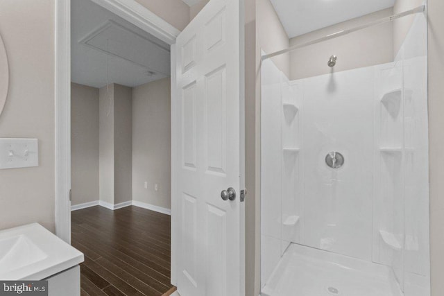 101 Poppleton St, Baltimore, MD 21201 - full bath featuring a walk in shower, wood finished floors, and vanity