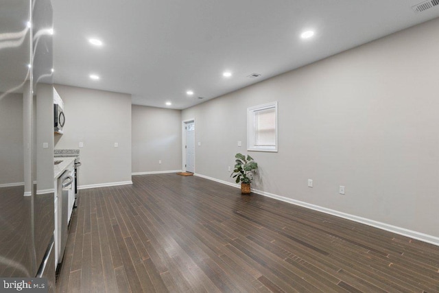 101 Poppleton St, Baltimore, MD 21201 - unfurnished living room featuring dark wood-style flooring, baseboards, and recessed lighting