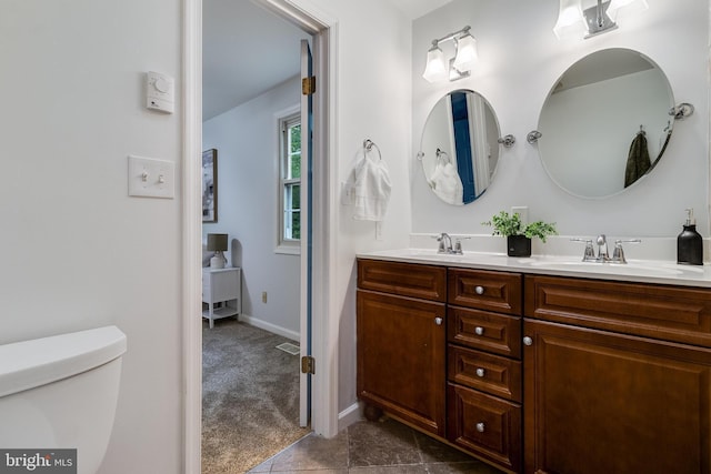 830 Willow Way, Prince Frederick, MD 20678 - full bath featuring toilet, double vanity, and baseboards