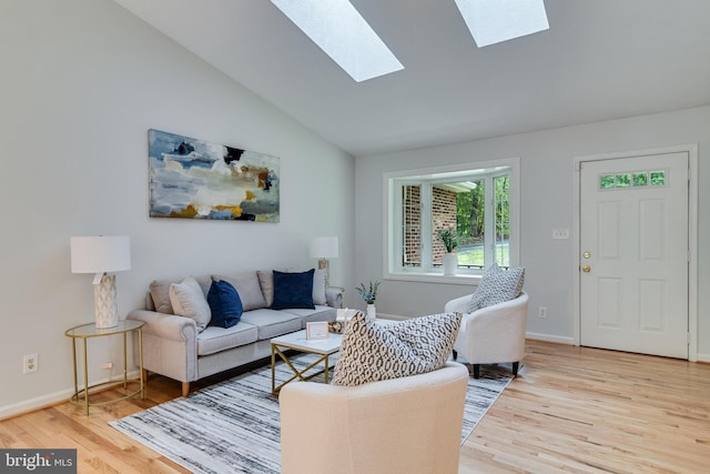 830 Willow Way, Prince Frederick, MD 20678 - living area with light wood-type flooring, a skylight, lofted ceiling, and baseboards