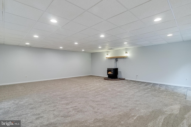 830 Willow Way, Prince Frederick, MD 20678 - below grade area featuring a wood stove, carpet floors, recessed lighting, and baseboards