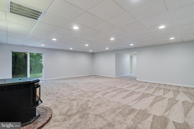 830 Willow Way, Prince Frederick, MD 20678 - unfurnished living room featuring carpet, a wood stove, recessed lighting, and baseboards