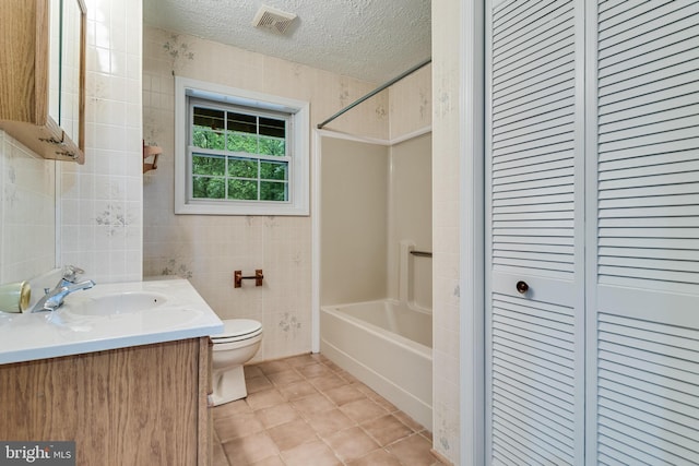 830 Willow Way, Prince Frederick, MD 20678 - full bathroom featuring toilet, vanity, shower / tub combination, a textured ceiling, and tile patterned floors