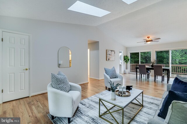 830 Willow Way, Prince Frederick, MD 20678 - living area featuring lofted ceiling, light wood-style floors, a skylight, and baseboards
