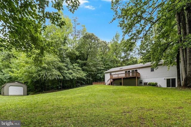 830 Willow Way, Prince Frederick, MD 20678 - view of grassy yard featuring an outbuilding, a deck, stairs, and a garage