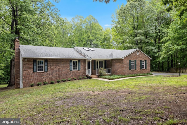 830 Willow Way, Prince Frederick, MD 20678 - view of front of house featuring brick siding, a front lawn, a chimney, and a porch