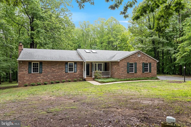 830 Willow Way, Prince Frederick, MD 20678 - ranch-style house featuring brick siding, a chimney, a porch, a front yard, and a shingled roof