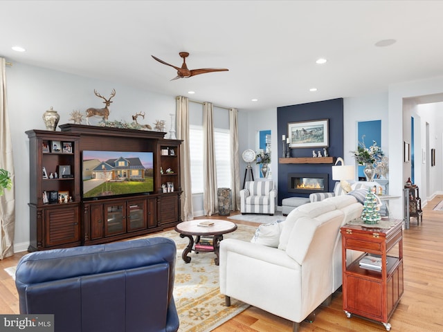 103 Titmouse Ct, Lake Frederick, VA 22630 - living area with ceiling fan, wood finished floors, a glass covered fireplace, recessed lighting, and baseboards