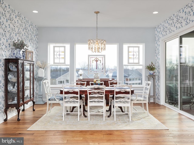 103 Titmouse Ct, Lake Frederick, VA 22630 - dining space with wallpapered walls, an accent wall, a chandelier, wood finished floors, and recessed lighting