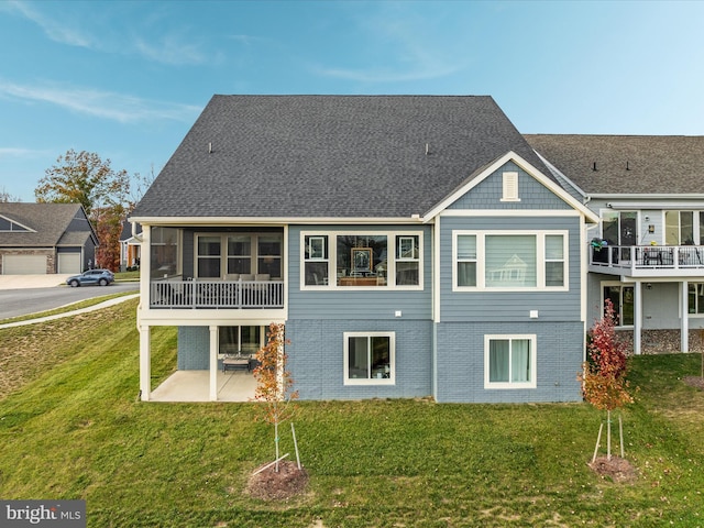 103 Titmouse Ct, Lake Frederick, VA 22630 - rear view of property featuring a patio area, a yard, brick siding, and a shingled roof