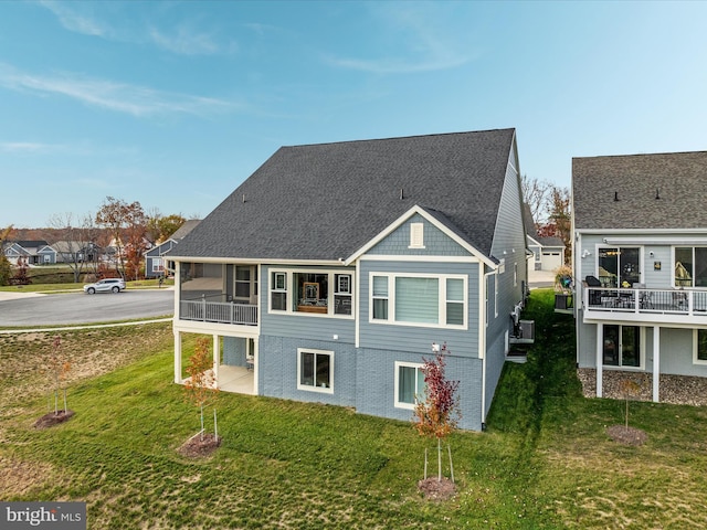 103 Titmouse Ct, Lake Frederick, VA 22630 - back of house with a lawn and a balcony