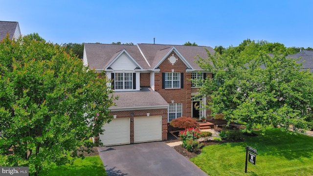 5736 Caribbean Ct, Haymarket, VA 20169 - view of front of home with asphalt driveway, a front lawn, brick siding, a garage, and roof with shingles