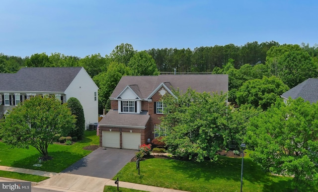 5736 Caribbean Ct, Haymarket, VA 20169 - traditional-style house featuring brick siding, driveway, an attached garage, and a front lawn