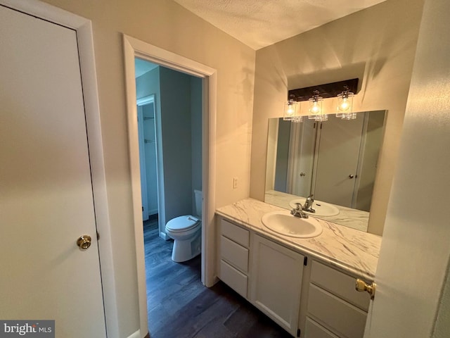 304 Rosedale Ave, Highspire, PA 17034 - bathroom featuring wood finished floors, toilet, and vanity