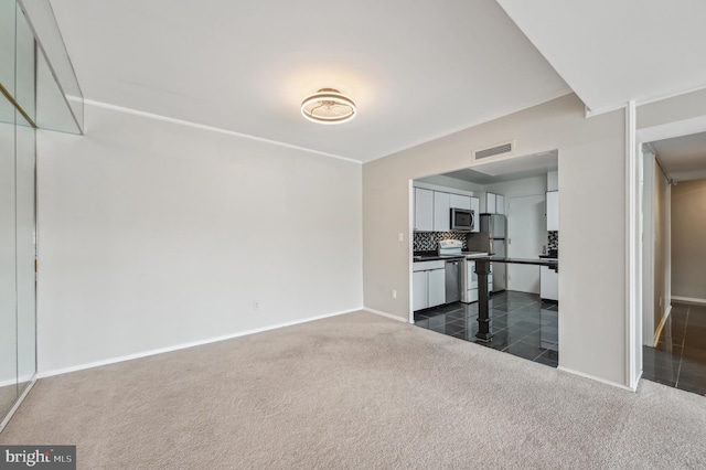 3601 Clarks Ln Unit 424, Baltimore, MD 21215 - unfurnished living room with dark colored carpet and baseboards