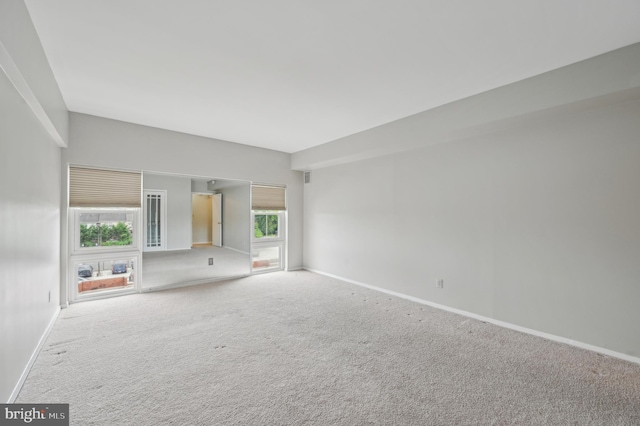 3601 Clarks Ln Unit 424, Baltimore, MD 21215 - spare room featuring carpet floors and baseboards