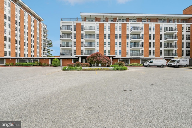 3601 Clarks Ln Unit 424, Baltimore, MD 21215 - view of apartment building / complex with uncovered parking