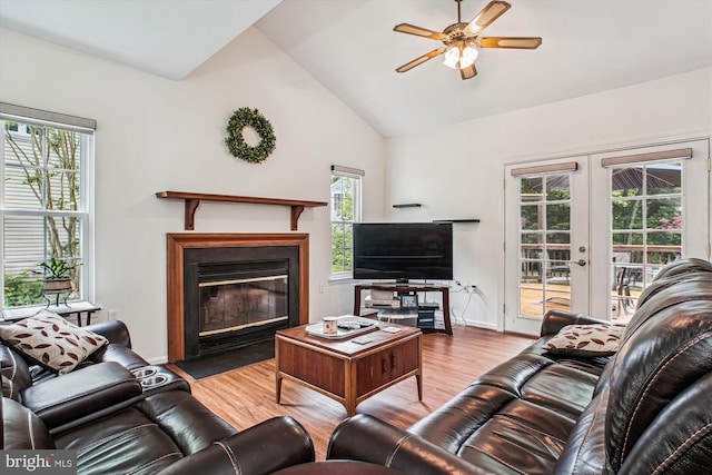 5441 Gladewright Dr, Centreville, VA 20120 - living area with a fireplace with flush hearth, wood finished floors, french doors, vaulted ceiling, and ceiling fan