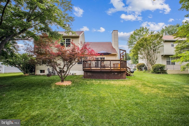 5441 Gladewright Dr, Centreville, VA 20120 - back of property featuring a wooden deck, a lawn, and a chimney